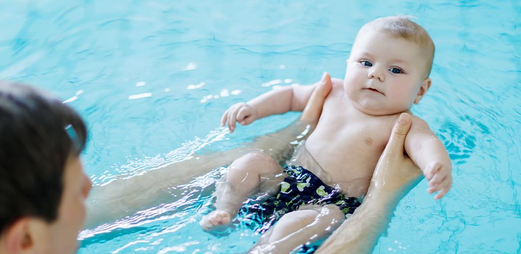 What precautions should be taken while making a baby swim